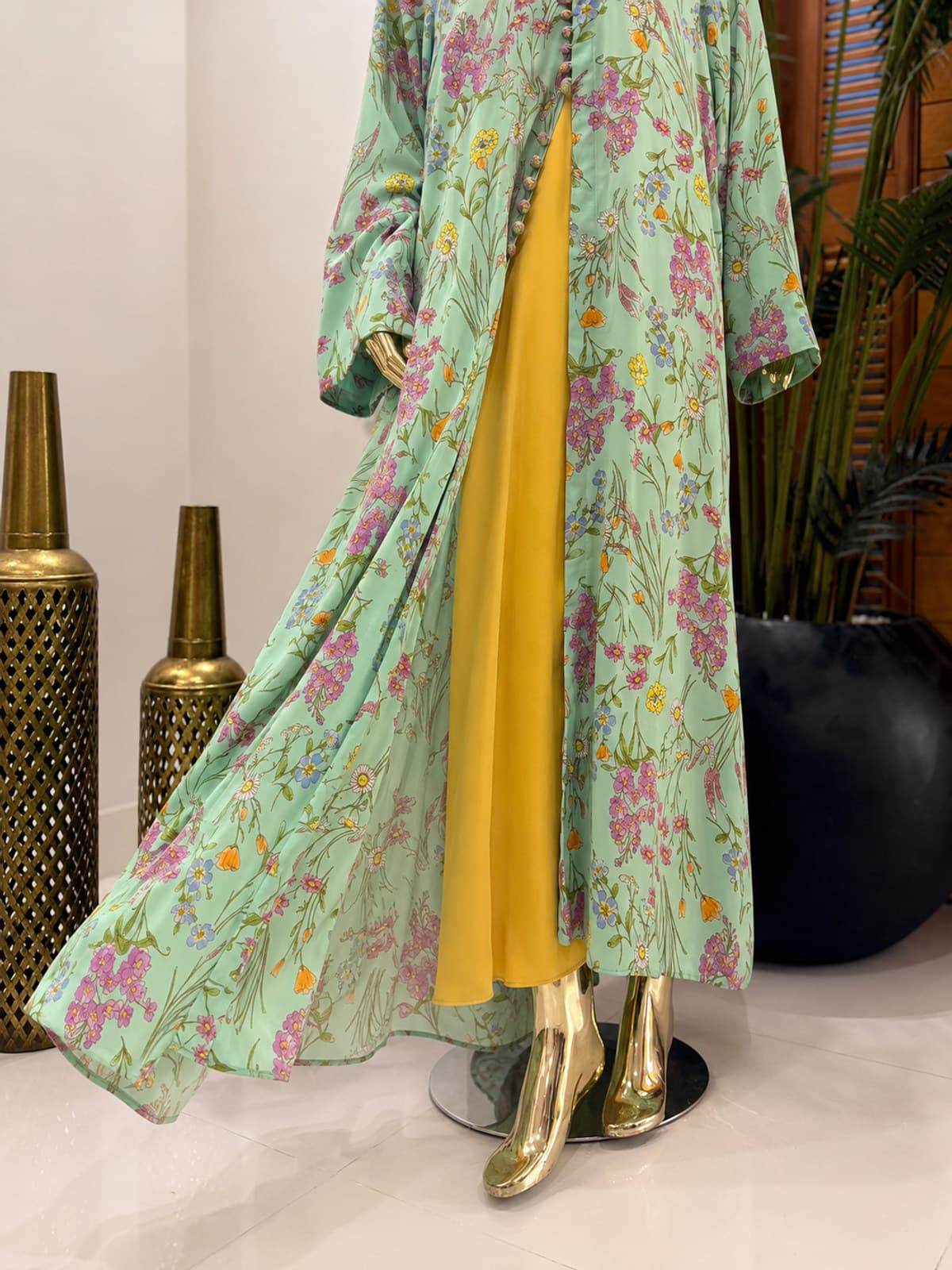 Meadow Bloom Abaya (with hijab) — styled in a room setting